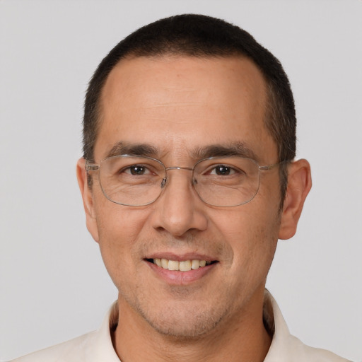 Joyful white adult male with short  brown hair and brown eyes