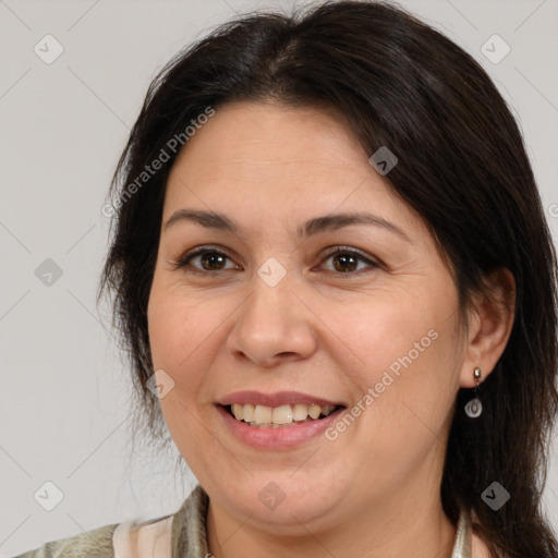 Joyful white adult female with medium  brown hair and brown eyes