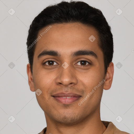 Joyful latino young-adult male with short  black hair and brown eyes