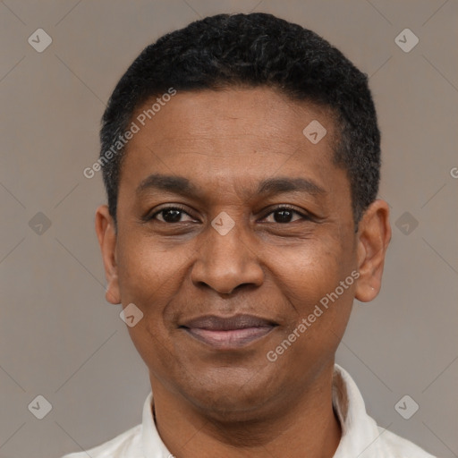 Joyful latino adult male with short  black hair and brown eyes