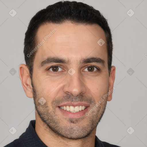 Joyful white young-adult male with short  black hair and brown eyes