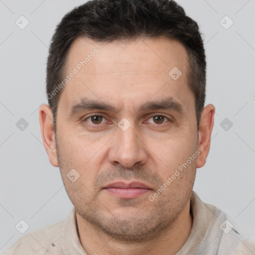 Joyful white adult male with short  brown hair and brown eyes