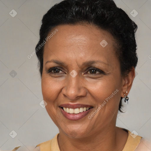 Joyful latino adult female with short  brown hair and brown eyes