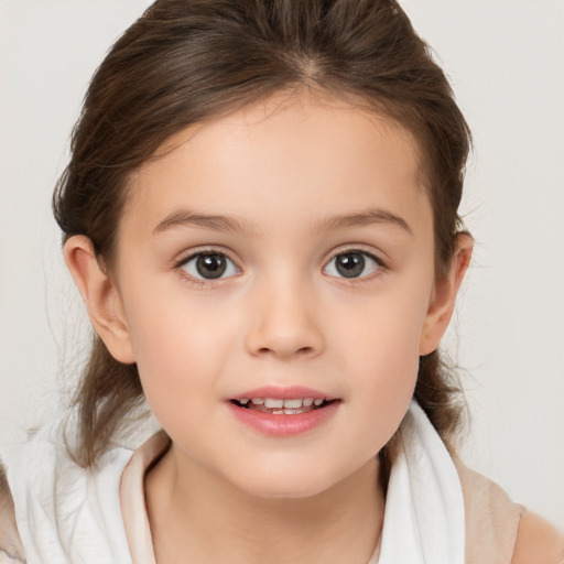 Joyful white child female with medium  brown hair and brown eyes