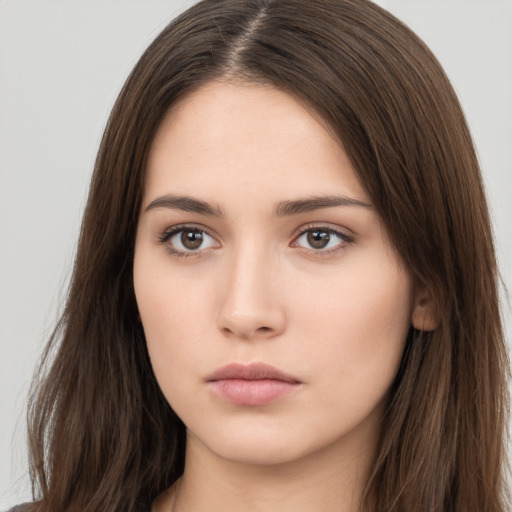 Neutral white young-adult female with long  brown hair and brown eyes