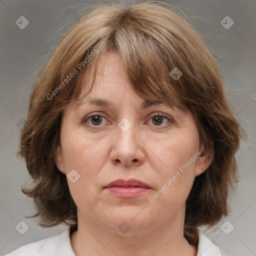 Joyful white adult female with medium  brown hair and grey eyes