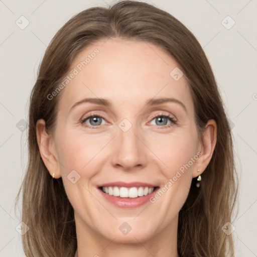 Joyful white adult female with medium  brown hair and grey eyes