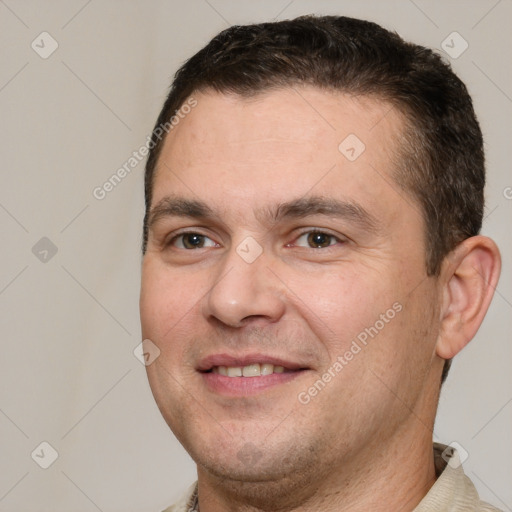 Joyful white adult male with short  brown hair and brown eyes