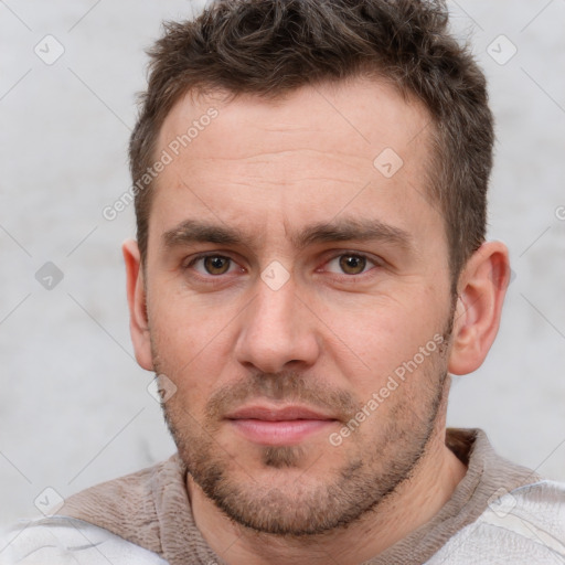 Joyful white adult male with short  brown hair and brown eyes