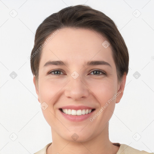 Joyful white young-adult female with short  brown hair and brown eyes