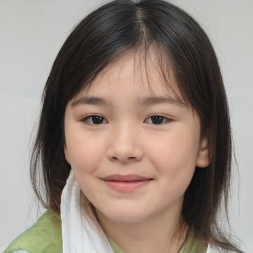 Joyful white child female with medium  brown hair and brown eyes