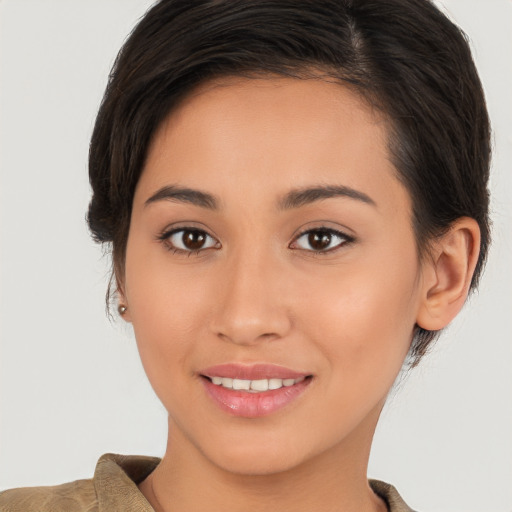 Joyful white young-adult female with medium  brown hair and brown eyes