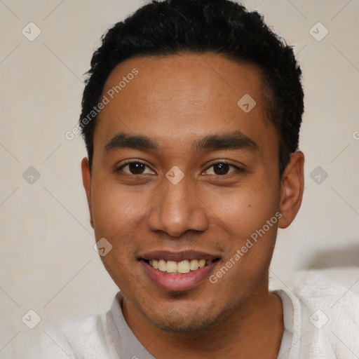 Joyful latino young-adult male with short  black hair and brown eyes