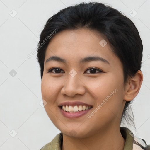 Joyful asian young-adult female with long  brown hair and brown eyes