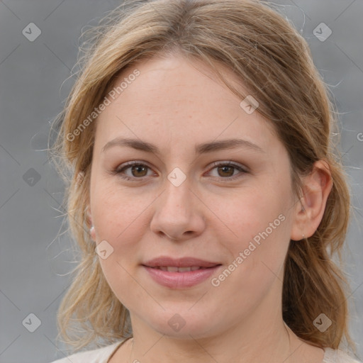 Joyful white adult female with medium  brown hair and brown eyes