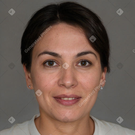 Joyful white adult female with short  brown hair and brown eyes