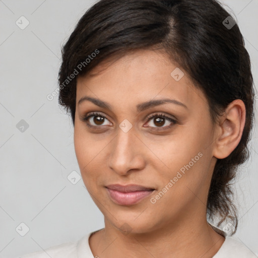 Joyful latino young-adult female with medium  brown hair and brown eyes