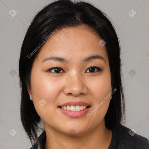 Joyful asian young-adult female with medium  black hair and brown eyes