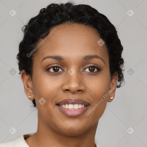 Joyful black young-adult female with short  brown hair and brown eyes