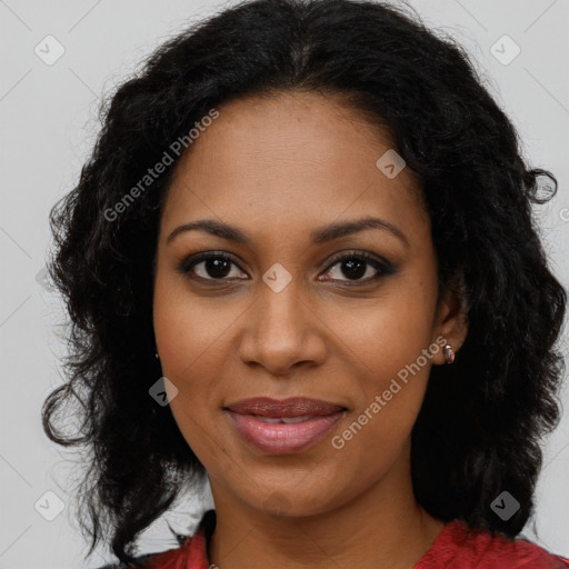 Joyful black adult female with long  brown hair and brown eyes