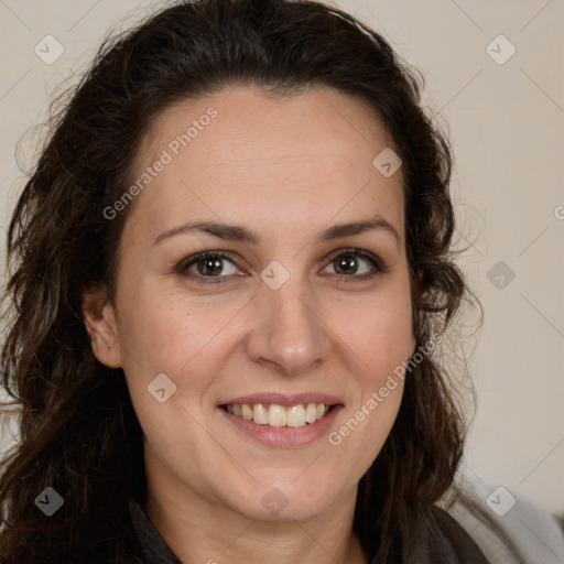 Joyful white adult female with long  brown hair and brown eyes