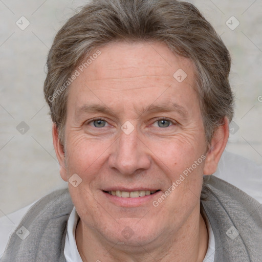 Joyful white adult male with short  brown hair and grey eyes