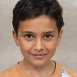 Joyful white child male with short  brown hair and brown eyes