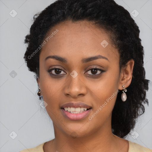 Joyful black young-adult female with long  black hair and brown eyes