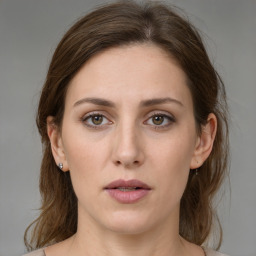 Neutral white young-adult female with medium  brown hair and brown eyes