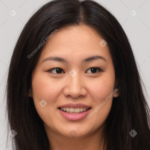 Joyful asian young-adult female with long  brown hair and brown eyes