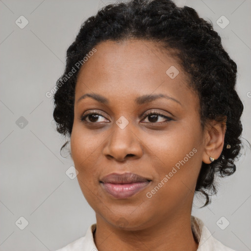 Joyful black adult female with short  brown hair and brown eyes