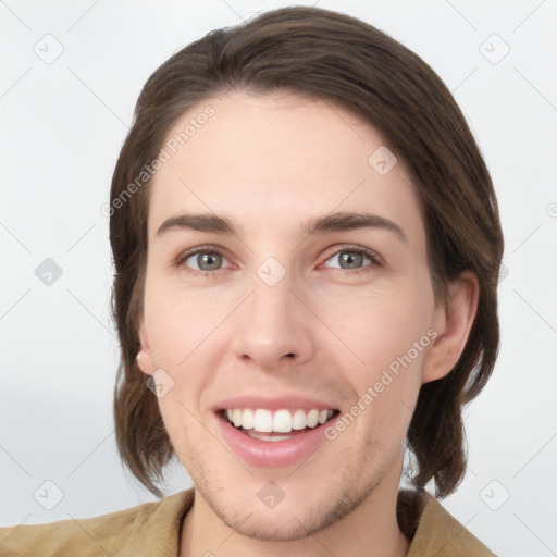 Joyful white young-adult female with medium  brown hair and grey eyes