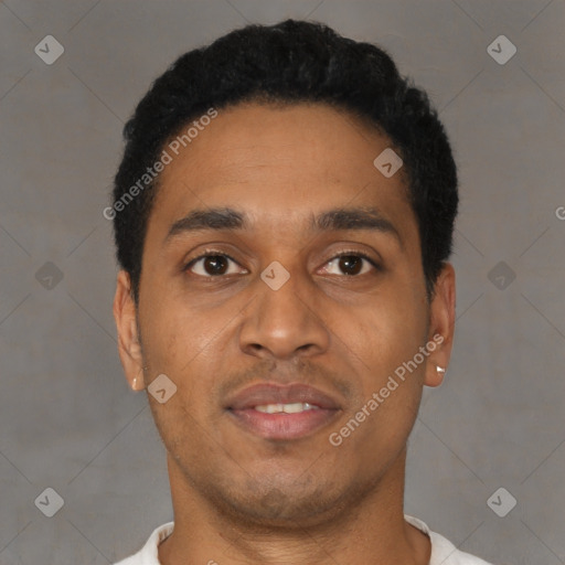 Joyful black young-adult male with short  black hair and brown eyes