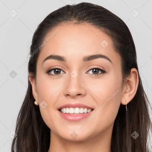 Joyful white young-adult female with long  brown hair and brown eyes