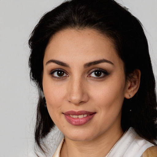 Joyful white young-adult female with medium  brown hair and brown eyes