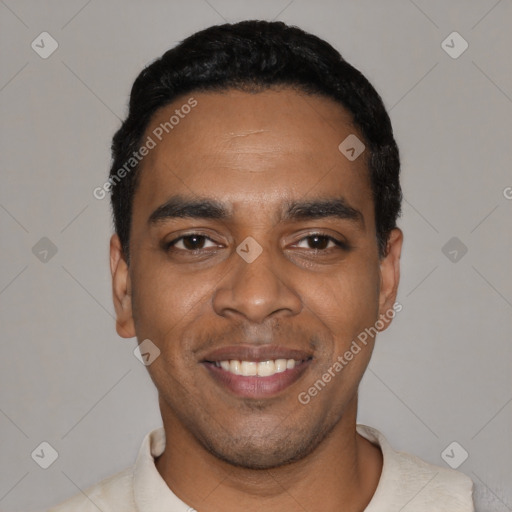 Joyful black young-adult male with short  black hair and brown eyes