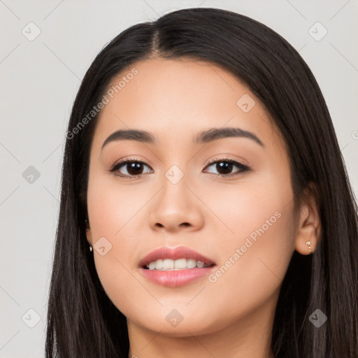 Joyful latino young-adult female with long  black hair and brown eyes