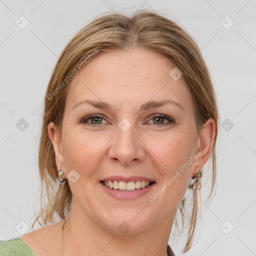 Joyful white adult female with medium  brown hair and grey eyes