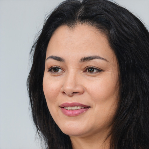 Joyful asian young-adult female with long  black hair and brown eyes