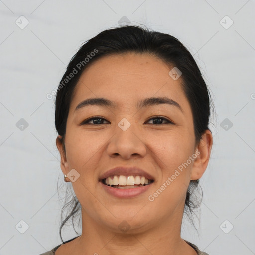 Joyful asian young-adult female with medium  black hair and brown eyes