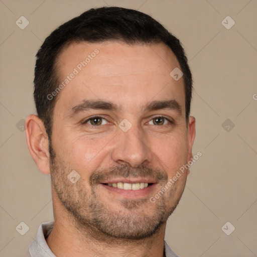 Joyful white adult male with short  brown hair and brown eyes