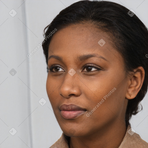 Neutral black young-adult female with long  brown hair and brown eyes