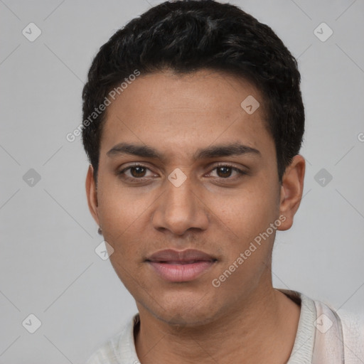 Joyful latino young-adult male with short  black hair and brown eyes