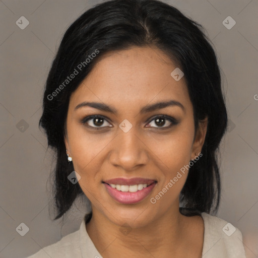 Joyful black young-adult female with medium  black hair and brown eyes