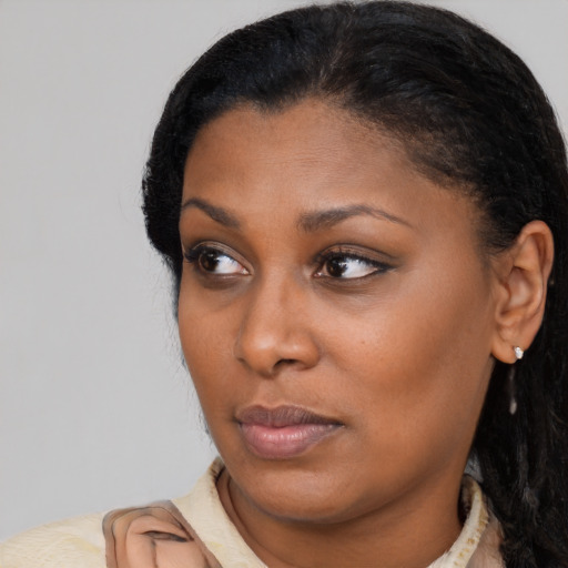 Neutral black young-adult female with short  black hair and brown eyes