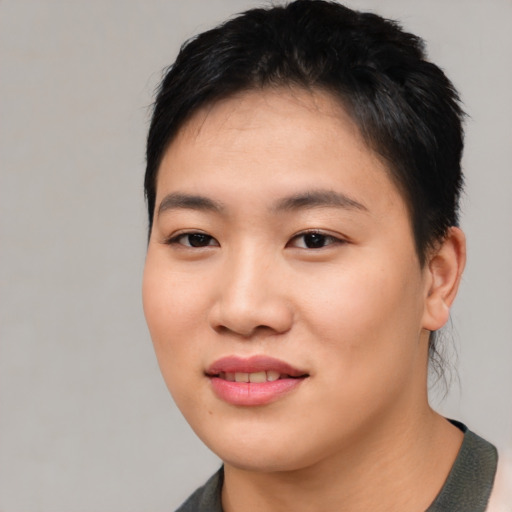 Joyful asian young-adult female with short  black hair and brown eyes