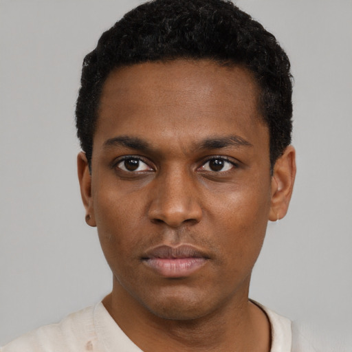 Neutral black young-adult male with short  black hair and brown eyes