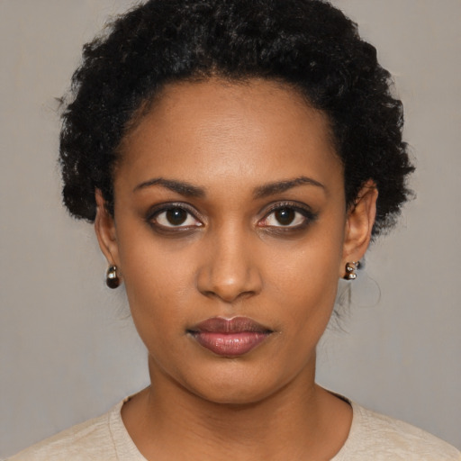 Neutral black young-adult female with short  black hair and brown eyes