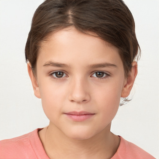 Joyful white child female with short  brown hair and brown eyes