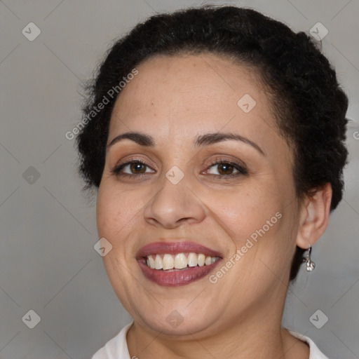 Joyful black adult female with short  brown hair and brown eyes